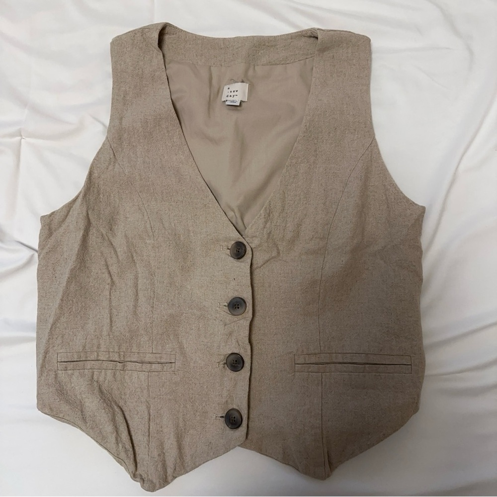 A New Day (Target Brand) tan button up vest.